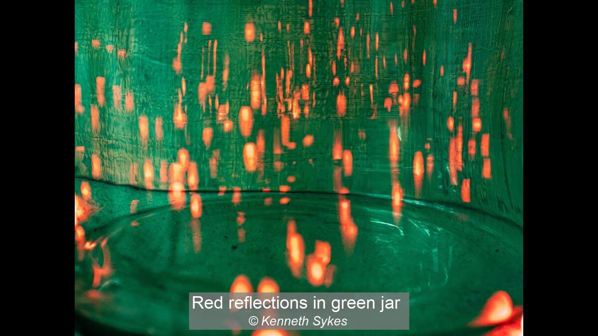 Red reflections in green jar